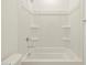 Close up view of the shower-tub combo with white surround and chrome fixtures at 4256 W Lisa Ln, San Tan Valley, AZ 85144