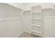 Walk-in closet with built-in shelving and rods for storage, carpeted floor at 4256 W Lisa Ln, San Tan Valley, AZ 85144