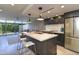 Stylish kitchen featuring quartz countertops, modern appliances, and seating at the island at 4411 N 40Th N St # 37, Phoenix, AZ 85018