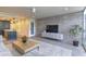 Modern living room featuring sleek furniture, exposed brick wall, and an open layout at 4411 N 40Th N St # 37, Phoenix, AZ 85018