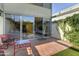 Enclosed patio with brick flooring connects seamlessly to the home's interior through sliding glass doors at 4411 N 40Th N St # 37, Phoenix, AZ 85018