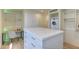 Walk-in closet featuring custom shelving, drawers, a central island, and a desk at 4411 N 40Th N St # 37, Phoenix, AZ 85018