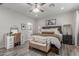 Cozy bedroom featuring a comfortable bed, stylish decor, neutral tones, and ample natural light at 4446 W Kimberly Way, Glendale, AZ 85308
