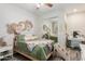 Stylish bedroom decor including a ceiling fan and a bed featuring decorative pillows and a throw blanket at 4446 W Kimberly Way, Glendale, AZ 85308