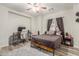 Bedroom area with modern furnishings, a ceiling fan, and a large desk area for work or play at 4446 W Kimberly Way, Glendale, AZ 85308