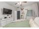 Spacious bedroom with a ceiling fan, a large bed, and dresser with TV, providing comfort and entertainment at 4446 W Kimberly Way, Glendale, AZ 85308