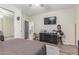 Bedroom area featuring a ceiling fan, closet area, and dresser with TV at 4446 W Kimberly Way, Glendale, AZ 85308