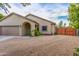 Charming single-story home featuring desert landscaping, neutral color palette, and a two-car garage at 4446 W Kimberly Way, Glendale, AZ 85308