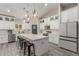 Well-equipped kitchen featuring a large island with seating, modern appliances, and ample storage space at 4446 W Kimberly Way, Glendale, AZ 85308