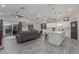 Spacious open-concept living area with kitchen, dining area, comfortable seating, and stylish lighting at 4446 W Kimberly Way, Glendale, AZ 85308
