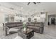Comfortable living room and kitchen, featuring modern furnishings, stylish lighting, and an open floor plan at 4446 W Kimberly Way, Glendale, AZ 85308