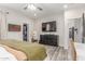 Spacious main bedroom with a TV, a ceiling fan, and an open walk-in closet at 4446 W Kimberly Way, Glendale, AZ 85308