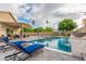 Sparkling pool featuring a waterfall feature, pavers, and plenty of space for lounging at 4446 W Kimberly Way, Glendale, AZ 85308