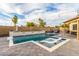 Sparkling pool featuring a waterfall feature, pavers, and plenty of space for lounging at 4446 W Kimberly Way, Glendale, AZ 85308
