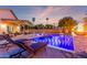 Sparkling pool featuring a waterfall feature, pavers, and plenty of space for lounging at 4446 W Kimberly Way, Glendale, AZ 85308