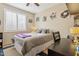 Cozy bedroom with sports themed decor, window with shutters, and a comfortable bed at 4515 E Casey Ln, Cave Creek, AZ 85331