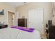 Bedroom with sporty decor, dresser, closet, and a doorway to another room at 4515 E Casey Ln, Cave Creek, AZ 85331