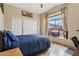 Bedroom with tiled floor, a large window, and a closet with bi-fold doors at 4515 E Casey Ln, Cave Creek, AZ 85331