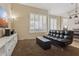 Versatile bonus room with sleek sofa, storage, and media setup, perfect for relaxation or entertainment at 4515 E Casey Ln, Cave Creek, AZ 85331