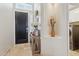 Welcoming entryway with tile flooring, decorative niche, and convenient access to the laundry at 4515 E Casey Ln, Cave Creek, AZ 85331
