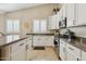 Kitchen with granite counters, sleek stainless steel appliances, and white cabinets for a modern touch at 4515 E Casey Ln, Cave Creek, AZ 85331