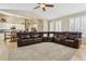 Spacious living room with open access to kitchen featuring comfortable leather seating at 4515 E Casey Ln, Cave Creek, AZ 85331