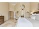 Main bedroom with neutral decor, tile floors, ensuite bathroom, and access to a walk-in closet at 4515 E Casey Ln, Cave Creek, AZ 85331