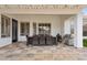 Covered patio with outdoor dining set, tiled floor, and a built-in grill at 4515 E Casey Ln, Cave Creek, AZ 85331