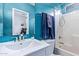 Bathroom featuring vanity with sink, framed mirror, and shower and tub combo at 45574 W Tulip Ln, Maricopa, AZ 85139