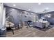 Relaxing bedroom space featuring recessed lighting, hardwood floors, and a hanging swing chair at 45574 W Tulip Ln, Maricopa, AZ 85139
