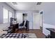 Bedroom with wood-look floors, closet and lots of natural light from large window at 45574 W Tulip Ln, Maricopa, AZ 85139