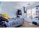 Bedroom with neutral walls and carpet with a window for plenty of natural light at 45574 W Tulip Ln, Maricopa, AZ 85139