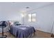 Bedroom with neutral walls and carpet with a window for plenty of natural light at 45574 W Tulip Ln, Maricopa, AZ 85139