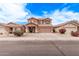 Charming two-story home with a well-maintained front yard and attached two-car garage at 45574 W Tulip Ln, Maricopa, AZ 85139