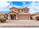 Charming two-story home with a well-maintained front yard and attached two-car garage at 45574 W Tulip Ln, Maricopa, AZ 85139