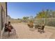 Outdoor patio perfect for entertaining, includes chairs and a fire pit at 4718 E Woburn Ln, Cave Creek, AZ 85331