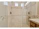 Close up of walk-in shower featuring tile and glass enclosure at 4718 E Woburn Ln, Cave Creek, AZ 85331