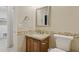 The bathroom features granite counters, wood cabinets, tiled backsplash and flooring, along with a decorative framed mirror at 4718 E Woburn Ln, Cave Creek, AZ 85331