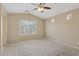 Bright bedroom with large window, carpet flooring, and neutral walls at 4718 E Woburn Ln, Cave Creek, AZ 85331