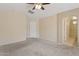 Spacious bedroom features a ceiling fan and access to the Primary bath and walk in closet at 4718 E Woburn Ln, Cave Creek, AZ 85331