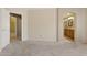 Bedroom with neutral walls and carpet, with entrances to bathroom and walk-in closet at 4718 E Woburn Ln, Cave Creek, AZ 85331