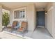 Cozy front porch features comfortable seating, offering a welcoming entry to the home at 4718 E Woburn Ln, Cave Creek, AZ 85331