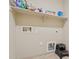 Laundry room with tile floor and storage shelving, hook ups and space for your washer and dryer at 4718 E Woburn Ln, Cave Creek, AZ 85331