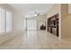 Bright living area with backyard access, built-in shelving, and neutral color palette at 4718 E Woburn Ln, Cave Creek, AZ 85331