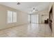 Bright living room showcasing tile floors, plantation shutters, and a ceiling fan at 4718 E Woburn Ln, Cave Creek, AZ 85331