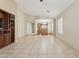 Spacious living room with neutral tile flooring and a built-in entertainment center at 4718 E Woburn Ln, Cave Creek, AZ 85331