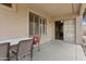 A covered patio with table and chairs provides a relaxing outdoor dining space with easy access through a sliding door at 4718 E Woburn Ln, Cave Creek, AZ 85331