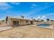 Charming backyard with a refreshing pool, covered patio, and a well-maintained lawn at 5101 E Toniko Dr, Phoenix, AZ 85044