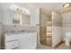 Bright bathroom with white vanity and glass block shower, offering a clean and modern design at 5101 E Toniko Dr, Phoenix, AZ 85044