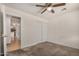 Bedroom features carpet, a ceiling fan, and a closet at 5101 E Toniko Dr, Phoenix, AZ 85044